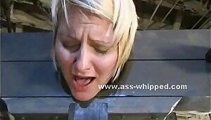 Blonde is bound in a medieval device